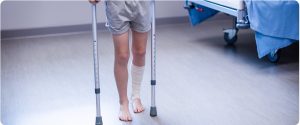 Care First Orthopaedic - girl walking with crutches